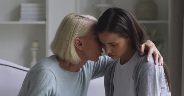 Worried mature mother comforting sad young daughter apologizing reconciling — Stock Video