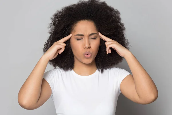 Head shot stressed African American female touching temples, breathing — Stock Photo, Image