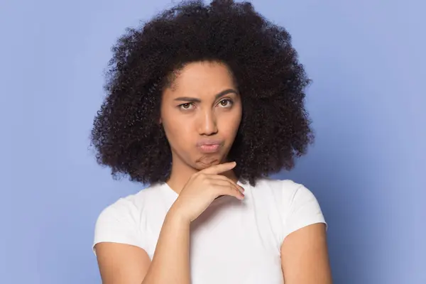 Head shot thoughtful uncertain African American girl touching chin — Stock Photo, Image