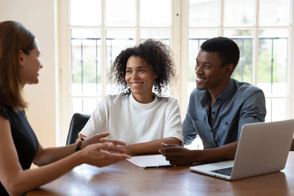 Smiling diverse clients meeting real estate agent at office. — ストック写真