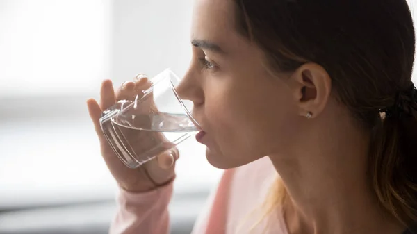 Close up of thirsty girl enjoying pure mineral water — Stock Photo, Image