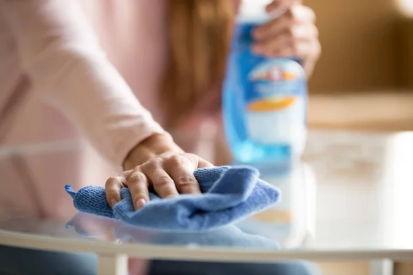 Close up of female dust off table with cloth — Stock Photo, Image