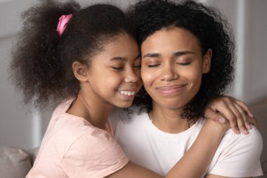African daughter cuddles mother people enjoy moment clipart