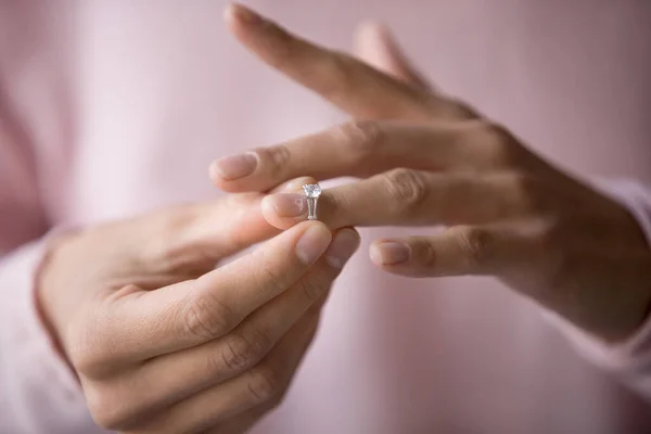 Close up of woman removing ring filing for divorce — ストック写真