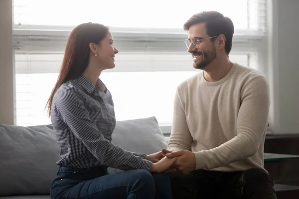 Happy young couple hold hands enjoying romantic moment — Stock Photo, Image