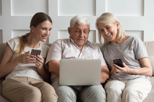 Addicted to technology happy family spending free time at home.