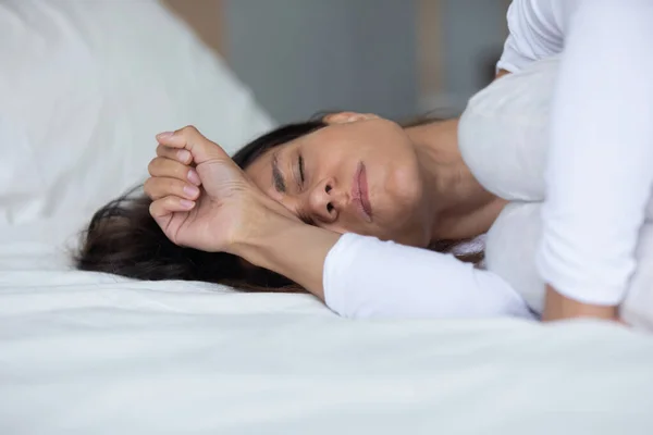 Woman lying in bed closed eyes crying feels miserable — Stock Photo, Image