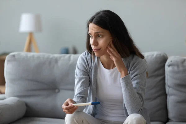 Woman feels frustrated about positive test and unplanned pregnancy — Stock Photo, Image