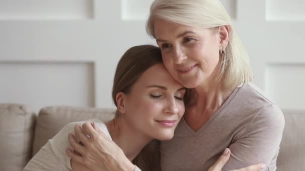 Happy mature mother embracing young daughter enjoy moments of tenderness — Stock Video