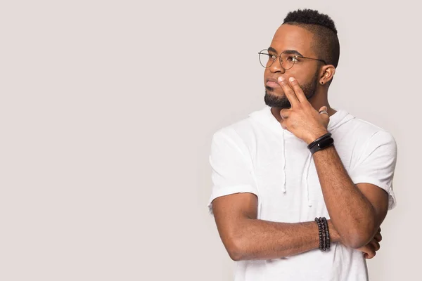 Thoughtful African American man looking aside at copy space — Stock Photo, Image