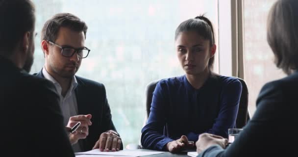 Confident female leader negotiating with business group at meeting — Stock Video