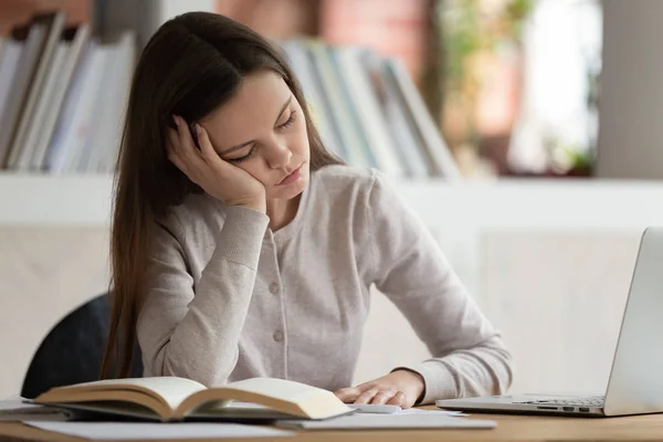 Exhausted young girl falls asleep during preparation for final examination. — Stock Photo, Image
