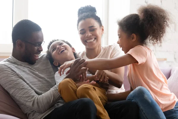 Overjoyed biracial family with kids have fun at home — Stock Photo, Image