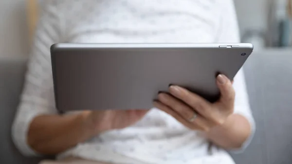Closeup view female hands holding digital electronic device tablet computer — Stock Photo, Image