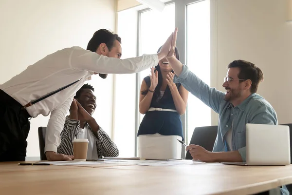 Excited guys team leaders giving high five sharing common success — Stock Photo, Image