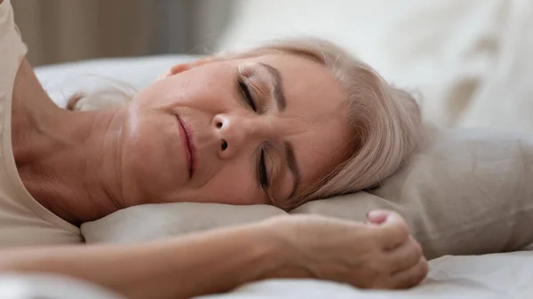 Close up view sleeping middle-aged woman lying on pillow — Stock Photo, Image