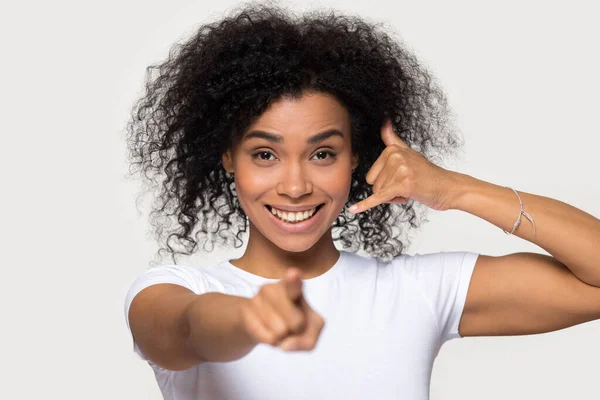 Attractive smiling African American woman showing call me gesture — Stock Photo, Image