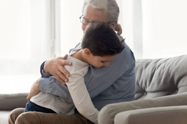 Grandfather embraces grandchild enjoy moment of caress and tenderness — Stock Photo, Image
