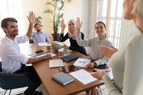 Happy mixed race young colleagues voting for decisions. — Stock Photo, Image