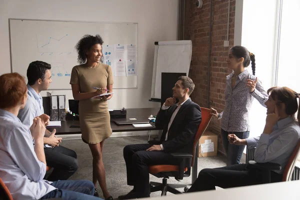 Diverse employees listening african business coach at corporate training — Stock Photo, Image