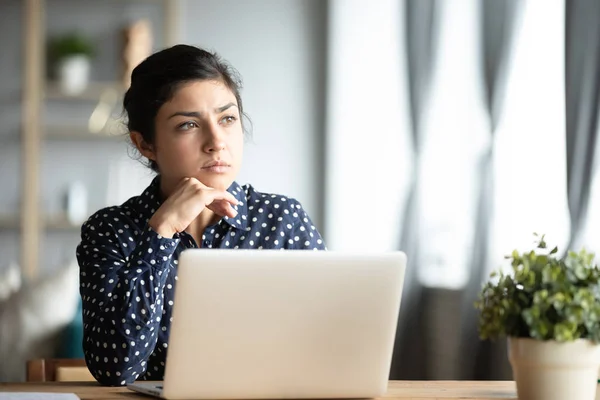 Serious thoughtful indian sit with laptop thinking of inspiration ideas — Stock Photo, Image