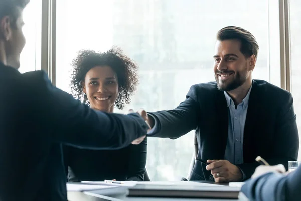Happy businesspeople shake hands getting acquainted at office meeting — Stock Photo, Image