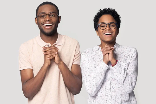 African couple being in state of miracle anticipation studio shot — Stock Photo, Image