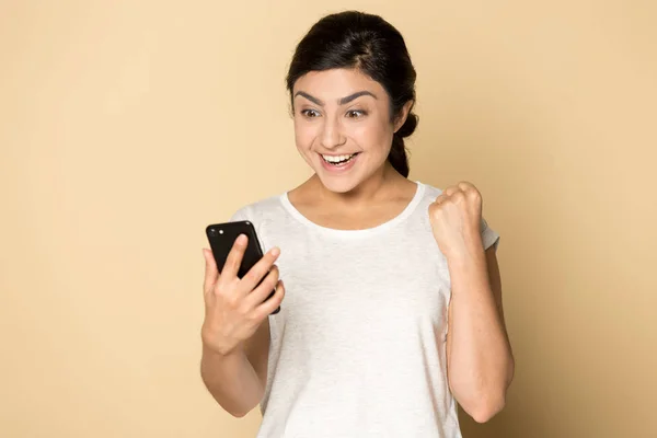 Overjoyed surprised young indian lady received good news notification. — Stock Photo, Image