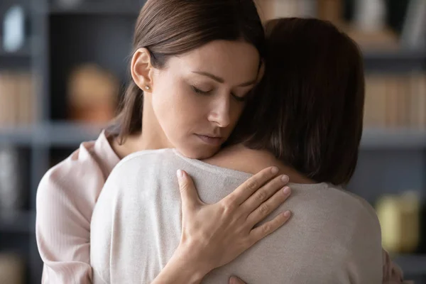 Sad adult mom and daughter embrace after fight — Stock Photo, Image