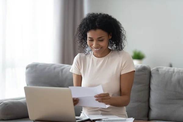 African woman read letter from clinic medical test good results