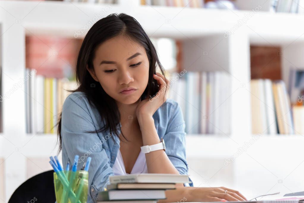 Unmotivated Asian student feel bored unable to study