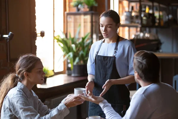 Angry client couple complain about bad service to waitress — Stock Photo, Image