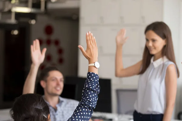 Diverse colleagues raise hands engaged in teambuilding activity — Stock Photo, Image