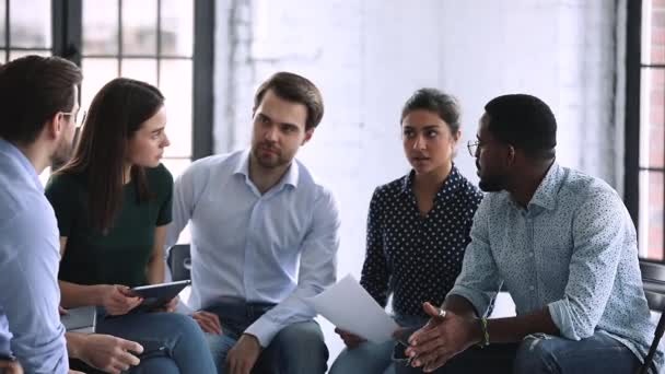 Friendly creative multiethnic team brainstorming share ideas sit in circle — Stock Video