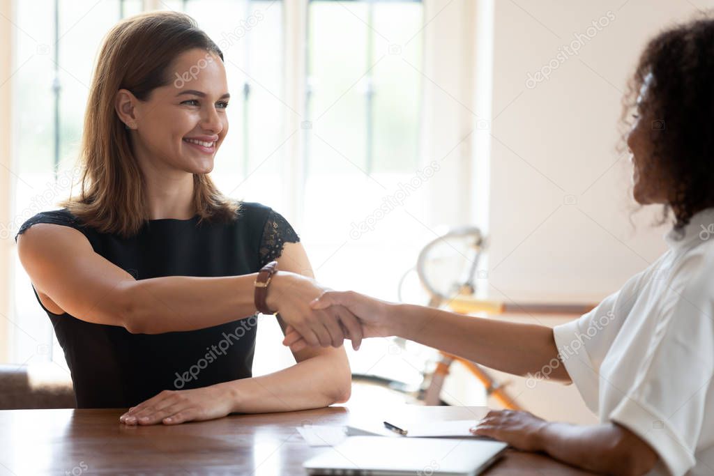 African American hr manager shaking hand of skilled candidate