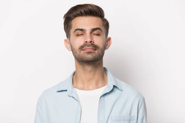 Close up young calm man calming down, relaxing. — Stock Photo, Image