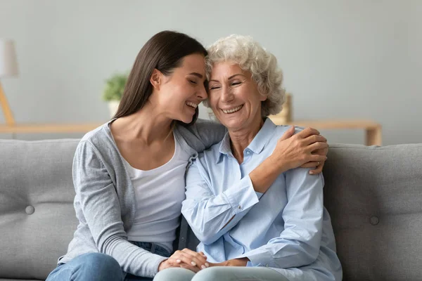 Happy grandmother and granddaughter touching foreheads, expressing love — Stock Photo, Image