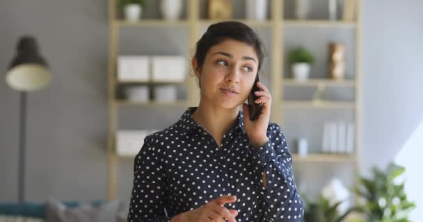 Young indian woman make phone call standing at home office — 비디오