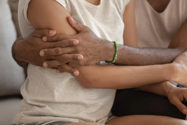 Close up cropped image african couple in love cuddling indoors — Stock Photo, Image