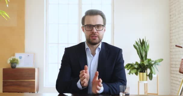 Confident businessman wear suit speak look at camera in office — Stok video