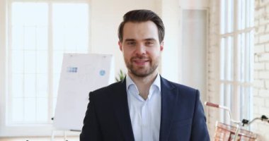 Happy confident businessman show thumb up look at camera