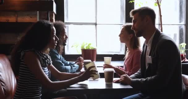 African american man and woman meeting caucasian partners. — Stok video