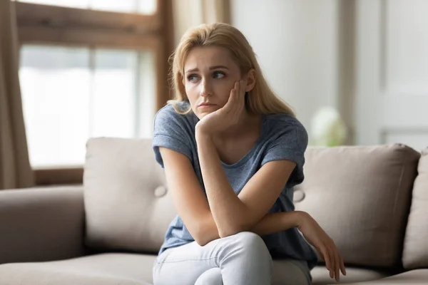 Stressed upset young blonde woman thinking of personal troubles. — Stock Photo, Image