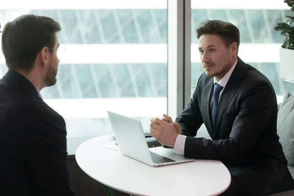Confident male hr manager holding interview with young job seeker. — Stock Photo, Image