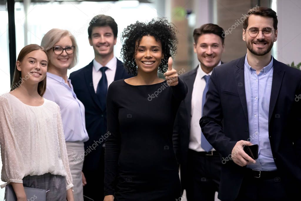 Portrait of excited biracial woman satisfied with company team choice.