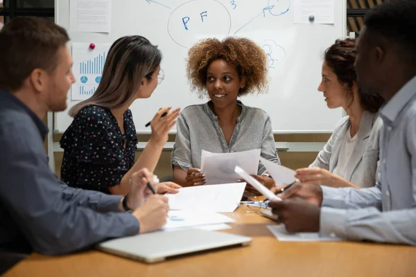 Multiracial businesspeople talk discussing business ideas at meeting — Stock Photo, Image