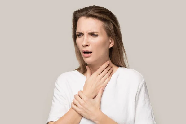 Unhealthy woman touch neck having sore throat or angina — Stock Photo, Image