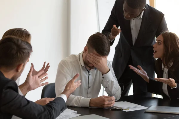 Frustrated employee feels stressed suffers from hostile coworkers — Stock Photo, Image