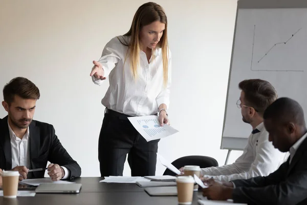 Female boss and employee having conflict during meeting in boardroom — Stock Photo, Image