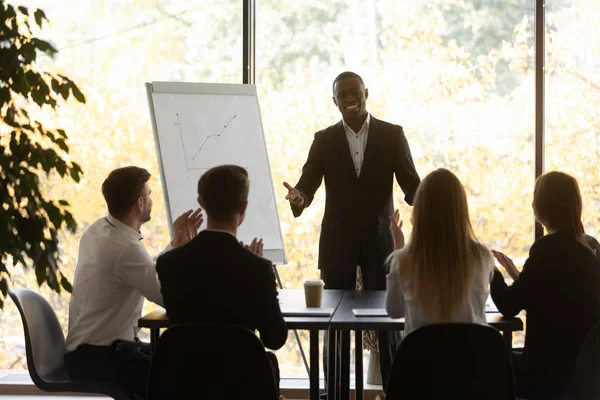 African business trainer receiving applause and appreciations for presentation — Stock Photo, Image